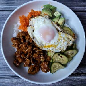 the best gochujang chicken rice bowl with marinated cucumbers