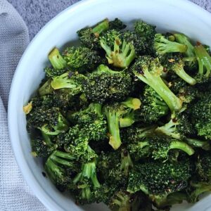 Stir-fried broccoli served in a bowl.