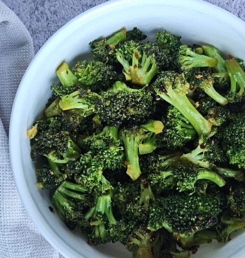Stir-fried broccoli served in a bowl.