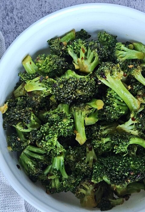 Stir-fried broccoli served in a bowl.
