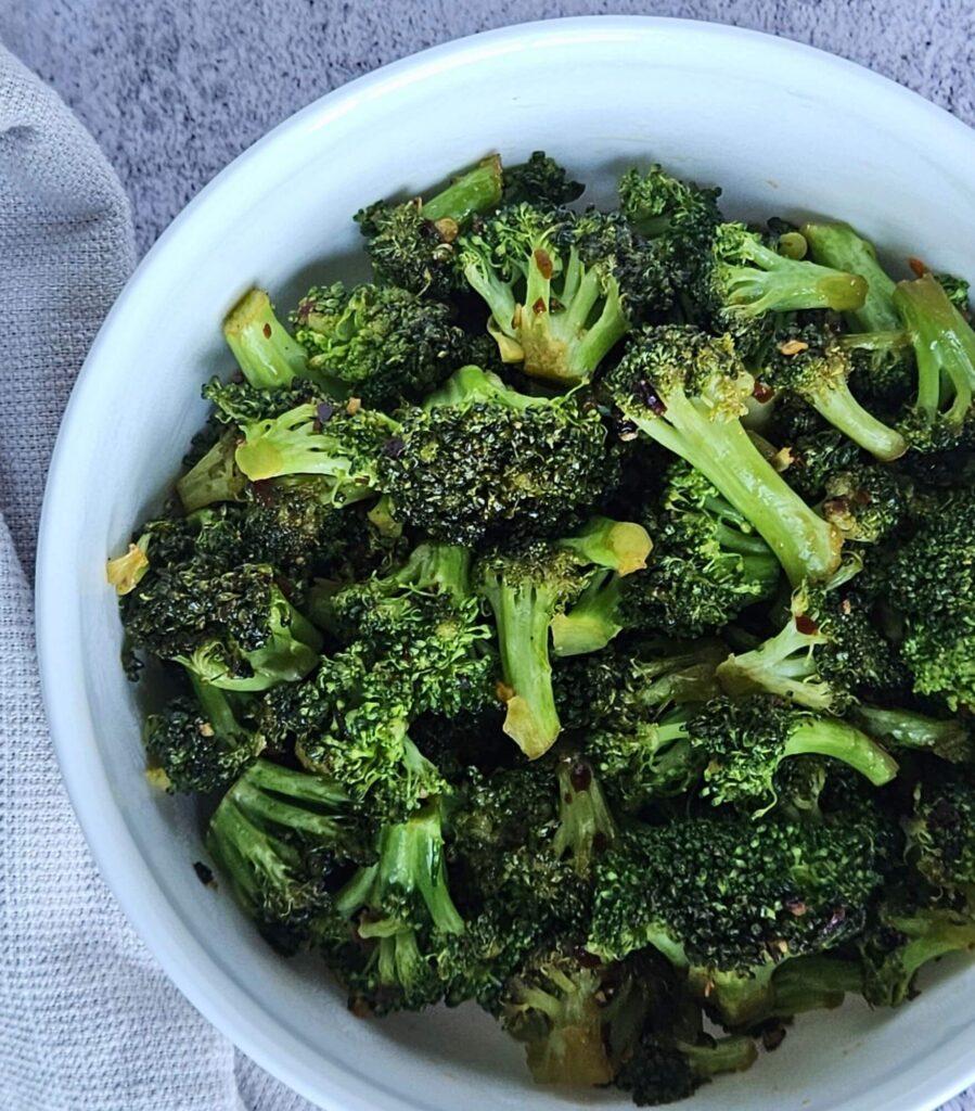 Stir-fried broccoli served in a bowl.
