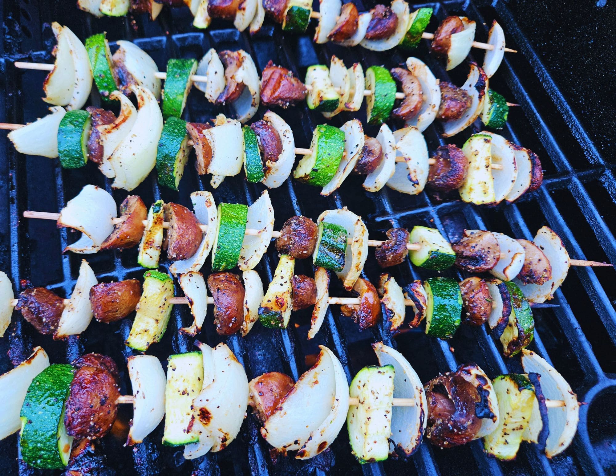 Photo of veggie skewers on the grill.