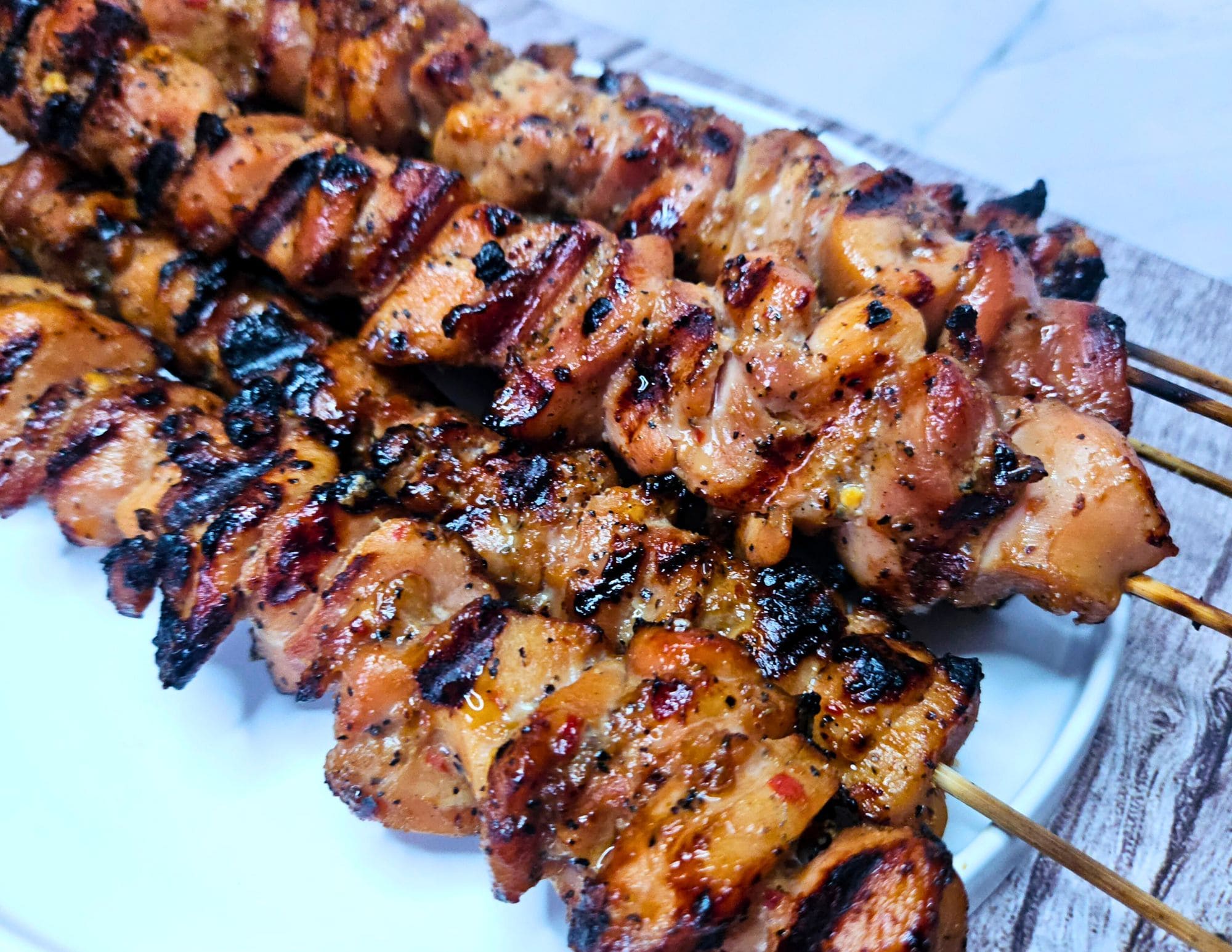 Image of Thai chicken skewers after being grilled. 