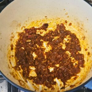 Sautéing onions, garlic and chipotle adobe for the base of the braising liquid.