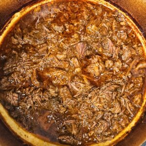 Image of shredded chuck roast after being braised.