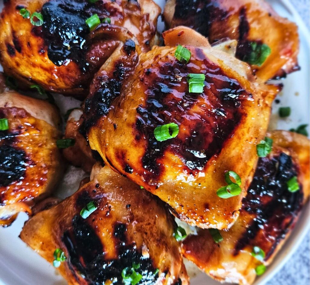 Image of sweet and spicy Thai chicken thighs after being grilled.