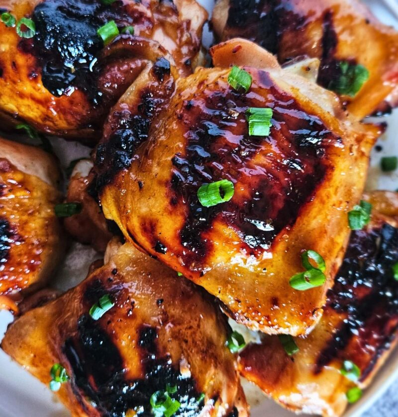 Image of sweet and spicy Thai chicken thighs after being grilled.