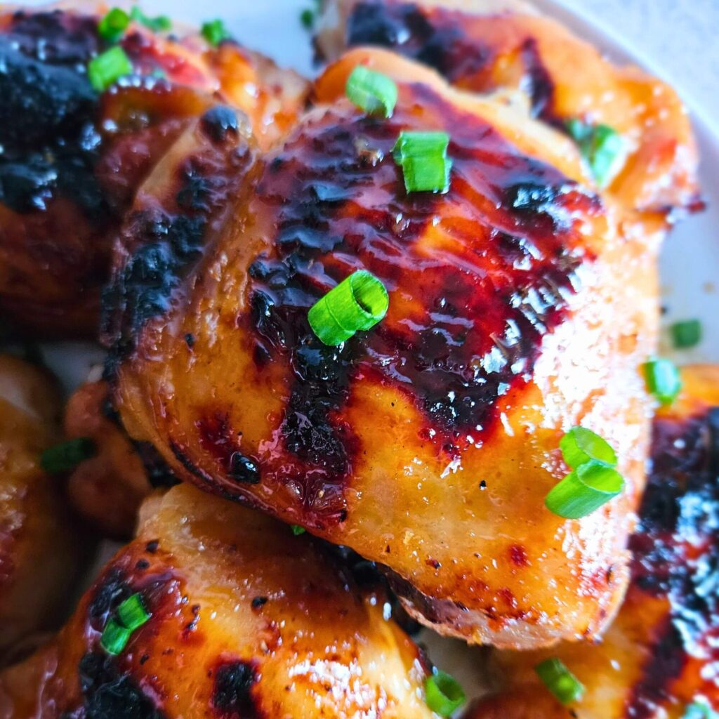 Close up image of sweet and spicy Thai chicken thigh.