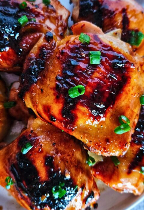 Image of sweet and spicy Thai chicken thighs after being grilled.