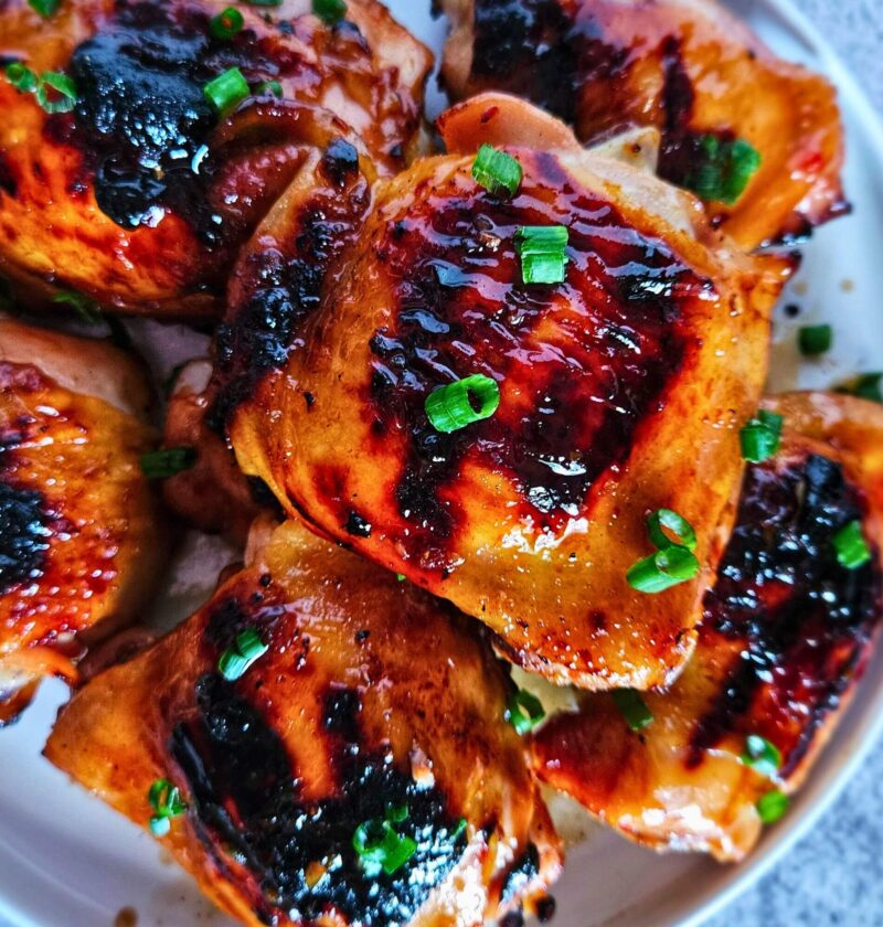Image of sweet and spicy Thai chicken thighs after being grilled.