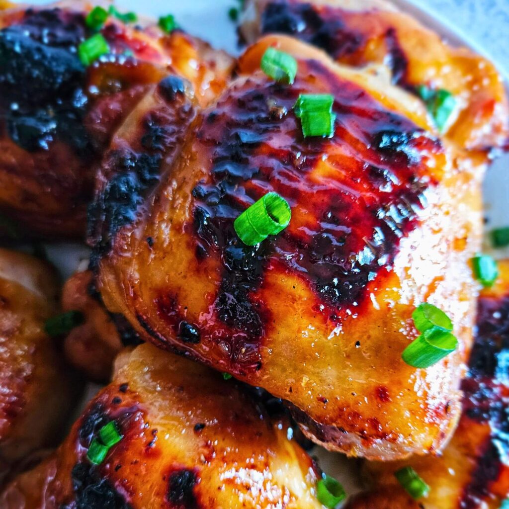 Close up image of sweet and spicy thai chicken thigh.