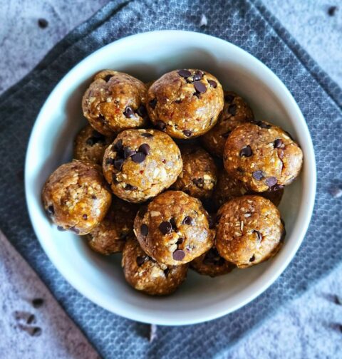 Image of healthy cookie dough balls being served in a bowl.