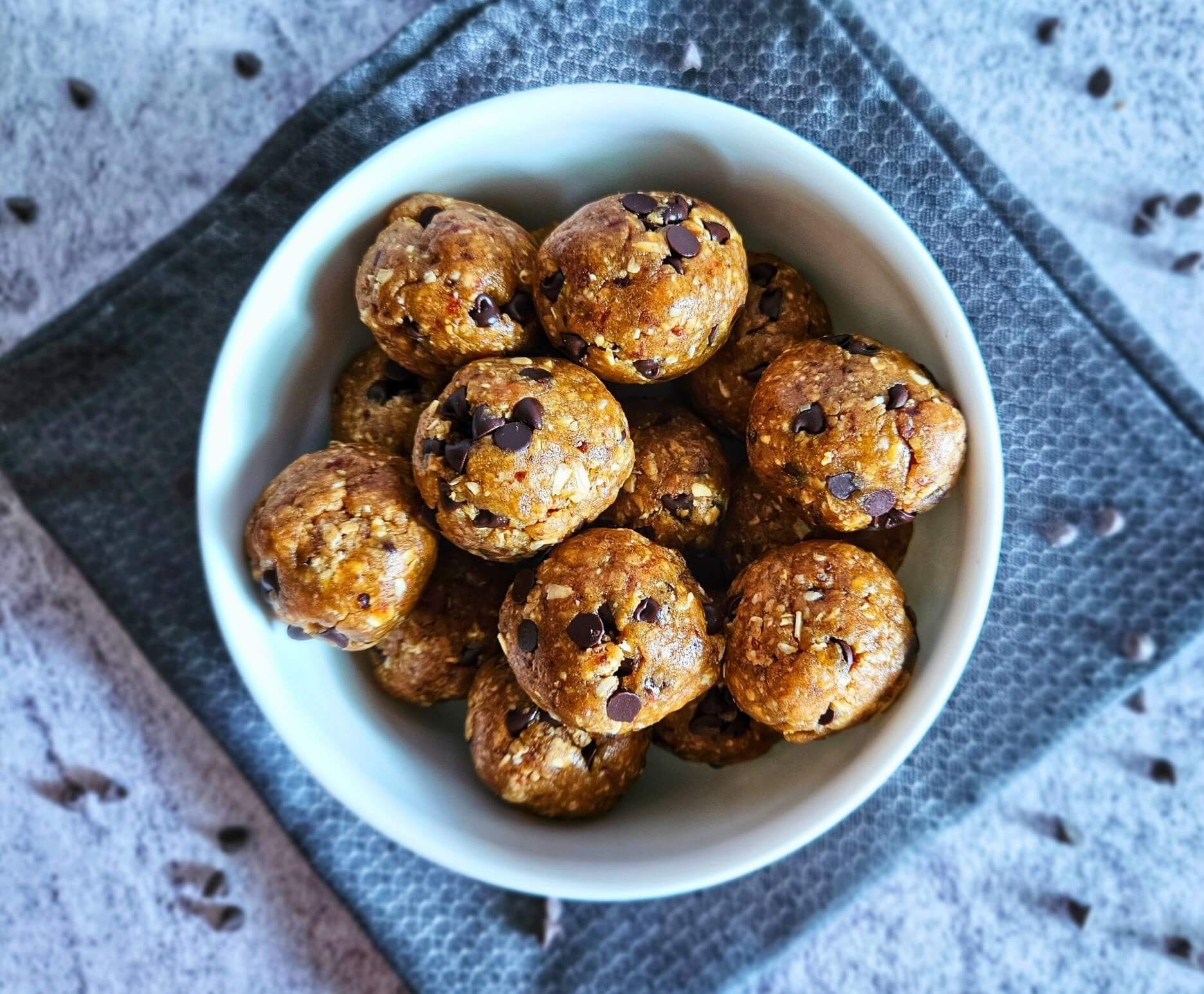 Image of healthy cookie dough balls being served in a bowl. 