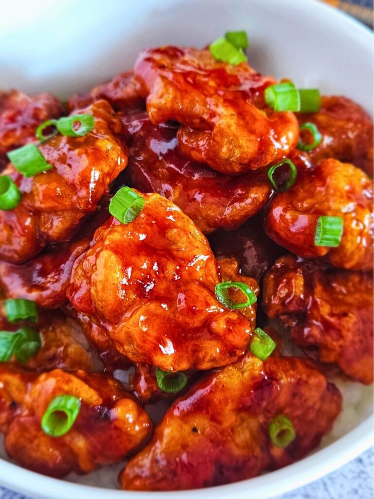 Close up image of air fryer Korean fried chicken in a serving bowl. 
