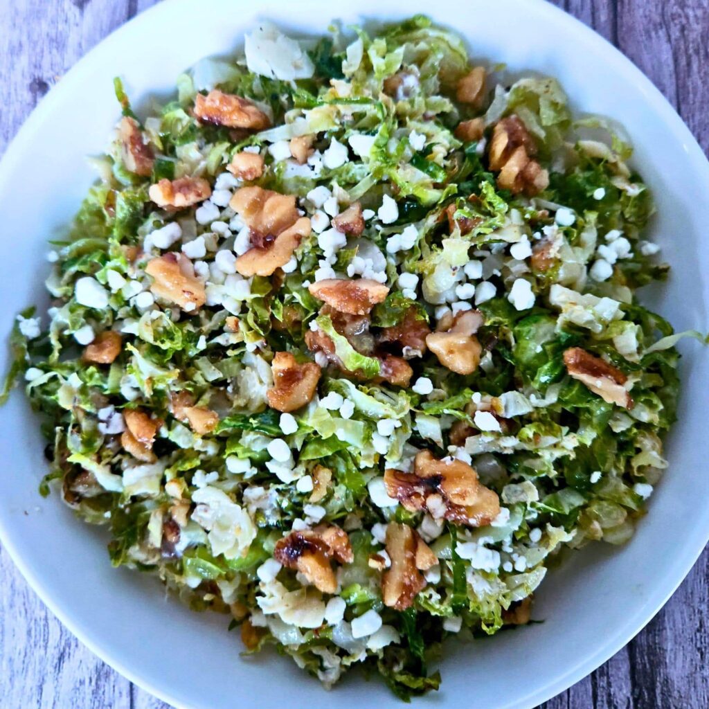 Roasted brussels sprouts salad with maple glazed walnuts and goat cheese.
