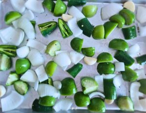 Veggies before being roasted for the avocado tomatillo salsa.