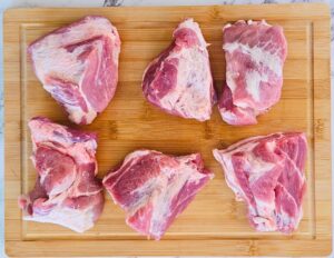 Pork butt cut into large 2 inch chunks.