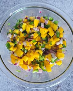 Mango salsa in a bowl after being made.
