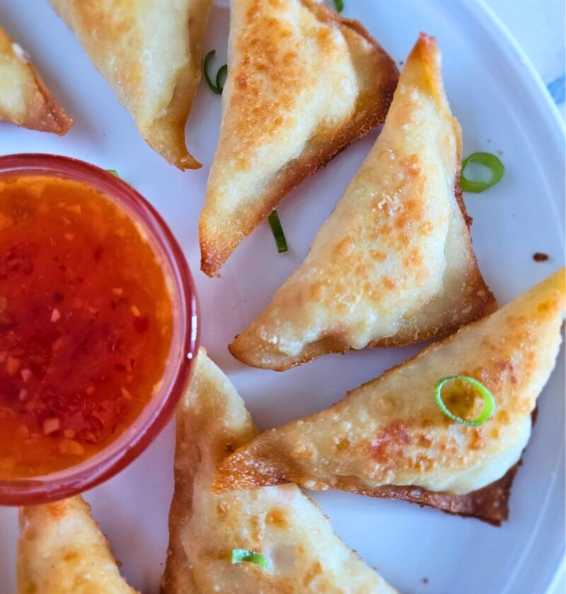 Crispy homemade crab rangoons served with dipping sauce – how to make crab rangoons easily.