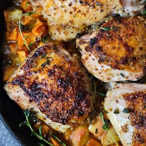 Close up image of apple cider glazed chicken thighs.