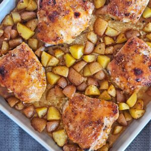 Sheet pan honey mustard chicken thighs with roasted potatoes.