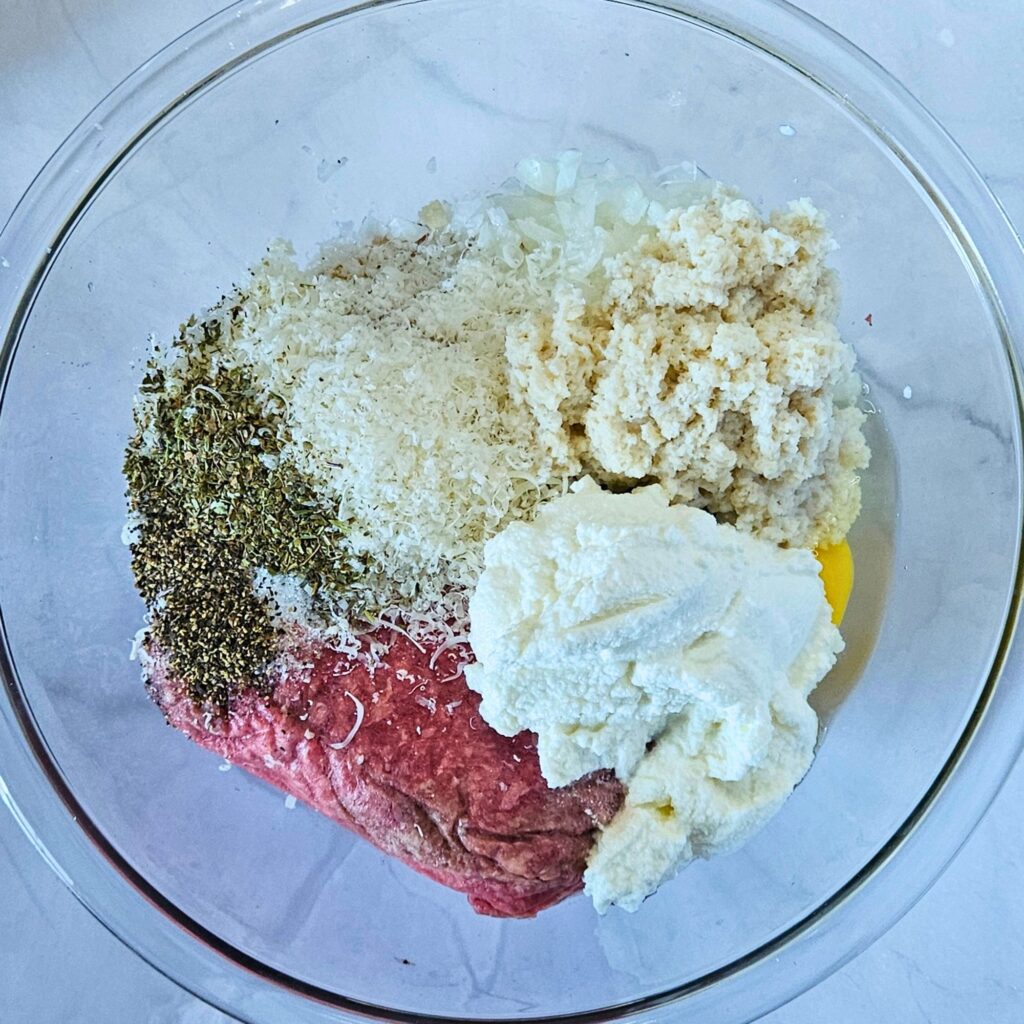 Bowl of ricotta meatball ingredients before mixing.