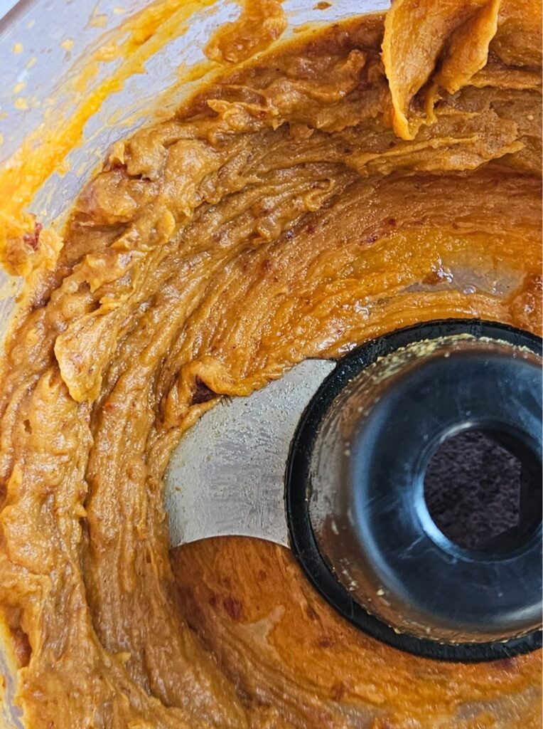 Prepared pumpkin caramel in food processor.