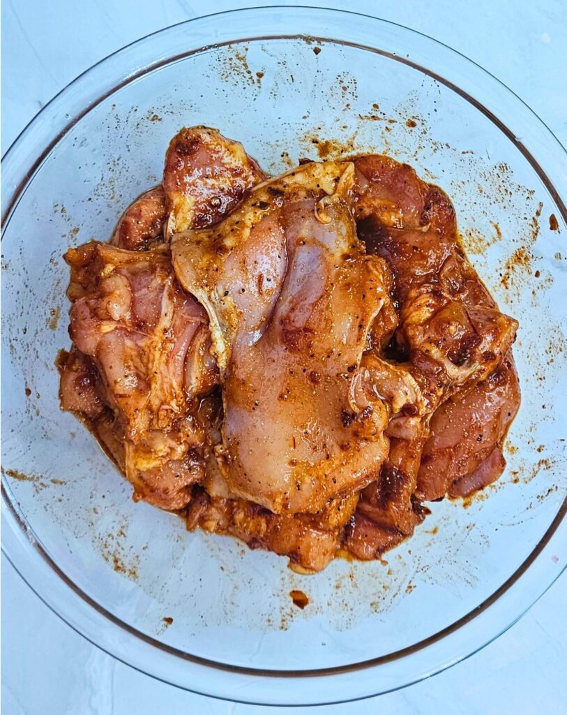 Maple Chipotle Chicken Tacos Prep 1 Maple chipotle chicken thighs marinating in a bowl.