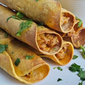 Image of cream cheese chicken taquitos after being air fried.