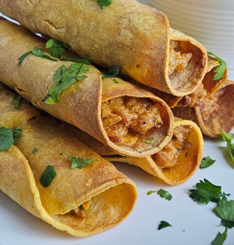 Image of cream cheese chicken taquitos after being air fried.