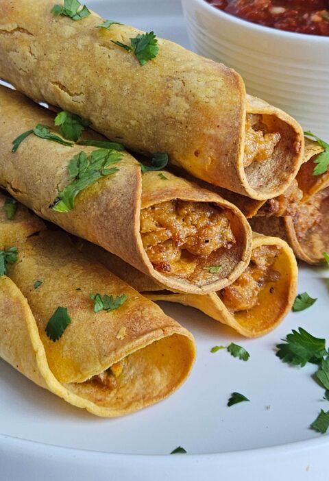 Image of cream cheese chicken taquitos after being air fried.