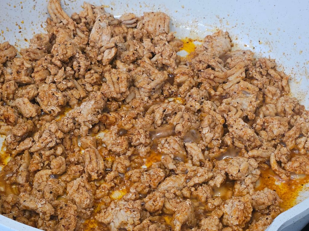 Image of seasoned cooked ground chicken for the cream cheese chicken taquitos stuffing.