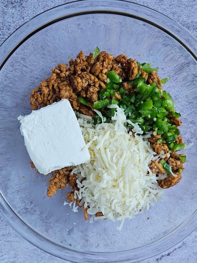 Image of ingredients for cream cheese chicken taquitos stuffing.